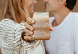Green chocolate smoothie with Daily Greens hidden inside, Chocolate collagen protein smoothie with creamy texture, Chocolate beauty berries smoothie purple pink and chocolate, Happy Cacao powder with smoothie ingredients flat lay