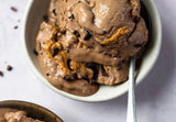 protein ice cream, snickers protein ice cream, banana ice cream recipe, vegan protein dessert, healthy ice cream, plant-based protein powder, high protein snack, chocolate peanut butter smoothie bowl, superplants vanilla protein, happy cacao recipe