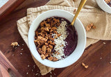 beauty berry nice cream in a bowl topped with fresh berries and coconut flakes, 3 ingredient nice cream beauty berries frozen bananas plant milk, antioxidant frozen dessert soft serve consistency beauty berry color