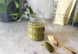 * high protein plant based green smoothie recipe in blender, daily greens smoothie with vanilla protein powder and frozen banana, creamy green banana protein smoothie morning ritual, plant protein morning smoothie with spinach