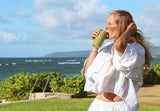 MRI scan machine symbolizing early detection, Green smoothie with spirulina and wheatgrass, Woman walking barefoot in nature, Family enjoying healthy plant-based meal, Relaxing yoga and meditation outdoors, Hands holding fresh turmeric root